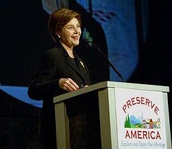 Mrs. Bush speaks at a podium that features the Preserve America logo.