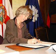 Interior Secretary Norton signs the MOU