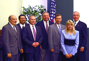 Several Economic Development Administration officials pose with the ACHP chairman after receiving the award