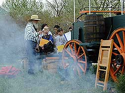Children watch a chuckwagon demonstration at Greeley, Colorado's, 2002 History Fest
