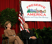 Mrs. Bush and ACHP Chairman John L. Nau, III,  sit under the Preserve America logo. (White House photo by Krisanne Johnson)