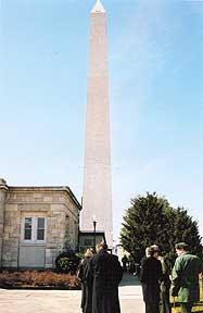 Washington Monument in background, task force members in foreground