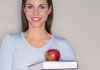 Lady with apple on book