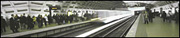 Panoramic - Train Arrives at Metro Station