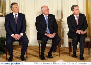 Former Prime Minister Tony Blair of the United Kingdom, is joined by Australia's former Prime Minister John Howard and Colombian President Alvaro Uribe as they sit onstage in the East Room of the White House Tuesday, Jan. 13, 2009, during a ceremony honoring them as 2009 recipients of the Presidential Medal of Freedom. Established by Executive Order in 1963, the medal is America's highest civil award. White House photo by Chris Greenberg