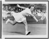Billie Jean King playing tennis at Wimbledon, 1964