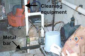 Photo of incident site showing cleaning equipment and metal bar.