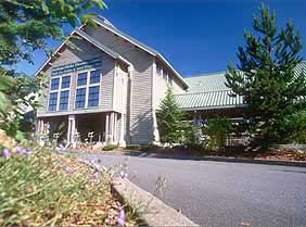 The entrance to the Southeast Alaska Discovery Center is reached along a curving drive surrounded by native plants.