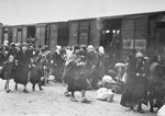 Hungarian Jews get off the deportation train and assemble on the ramp at Auschwitz-Birkenau in late May, 1944.