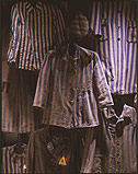 Detail of prisoners uniforms displayed on the second floor of the permanent exhibit at the U.S. Holocaust Memorial Museum.  Start with Jewish victims and additional victim groups, but also discuss behavior, motivations, and examples of perpetrators , bystanders, and rescuers.