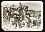Group portrait of six young Jewish women who are sunbathing in the Warsaw ghetto on the day they finished their high school matriculation exams.  July 1942  This image demonstrates the will to continue with life even under extreme circumstances.