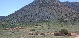 American flag flys behind ruins