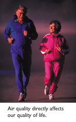 An elderly couple jogging.