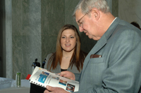 Community Affairs representative Adrienne Mingione shares the new HelpWithMyBank.gov publication with event attendees.