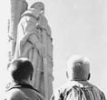 (NPS Photo) Young visitors look up at a statue of Juan Rodríguez Cabrillo