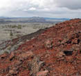 (NPS Photo) Red volcanic soils at Lava Beds