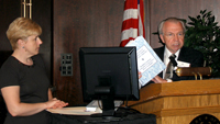 Center for the Book Director John Cole, right, introduces Maria Vedenyapina of the Pushkin Library Foundation and the new publication, "Building Nations of Readers: Experience, Ideas, Examples."