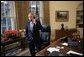 Standing at his desk in the Oval Office, President George W. Bush receives a phone call from Democratic presidential candidate John Kerry in which the senator conceded defeat in the 2004 presidential election Wednesday, Nov. 3, 2004.  White House photo by Eric Draper