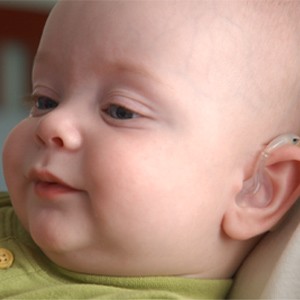 Infant with hearing aid