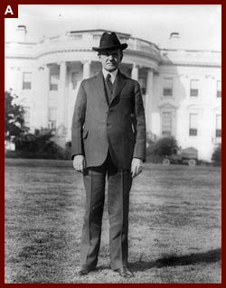 President Coolidge, full-length portrait, standing on south lawn of White House