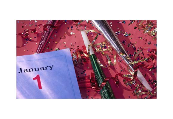 The photo is of confetti, streamers, and a calendar page displaying 