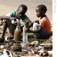 Children collect stagnant water for use at home in Glen View, Harare (File)