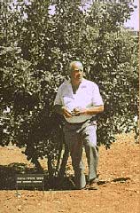 At Yad Vashem, the Israeli national institution of Holocaust commemoration, Oskar Schindler stands next to the tree planted in honor of his rescue efforts. Jerusalem, Israel, 1970.