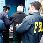 FBI agents help arrest members of organized crime in a massive Mafia takedown on February 7, 2008. Reuters photo.