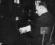 Friedrich Hoffman, a Czech priest, testifies at the trial of former camp personnel and prisoners from Dachau.