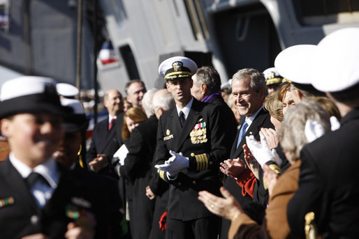 President George W. Bush watches as the crew comes aboard at the commissioning ceremony of the USS George H. W. Bush (CVN 77) aircraft carrier Saturday, Jan 10, 2009 in Norfolk, Va., named in honor of President Bush's father, former President George H. W. Bush. White House photo by Eric Draper
