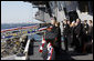 President George W. Bush stands with Mrs. Laura Bush during the playing of the national anthem at the commissioning ceremony of the USS George H. W. Bush (CVN 77) aircraft carrier Saturday, Jan 10, 2009 in Norfolk, Va., in honor of his father, former President George H. W. Bush, seen at right. White House photo by Eric Draper