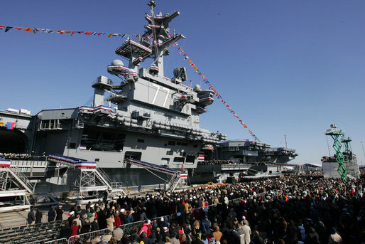 Guests and U.S. Navy personnel crowd the dock at the commissioning ceremony of the USS George H.W. Bush (CVN 77) aircraft carrier Saturday, Jan 10, 2009 in Norfolk, Va., named in honor of former President George H.W. Bush. White House photo by Joyce N. Boghosian