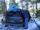 This photo shows the correct way to load your tree on your car - wrapped in a tarp and tied down with rope.