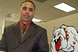 Alfredo Soto stands next to his depiction of a growling bulldog, the Marine Corps' mascot, in his work cubicle at the Marine Wounded Warrior Call Center in Dumfries, Va., Sept. 30, 2008. Defense Dept. photo by Gerry J. Gilmore