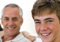boy and father smiling