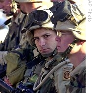 US soldiers from Charlie company of 1st battalion 504th parachute infantry regiment listen to briefing before going out on routine patrol mission (file photo)