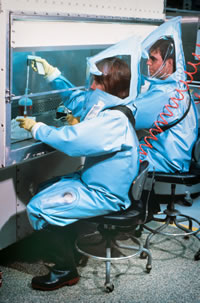 CDC laboratorians working in a BSL-4 Lab