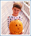 Boy Holding a Pumpkin