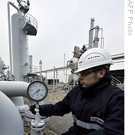 Worker checks manometer at EWE gas plant in northern German town of Nuettermoor, 09 Jan 2009