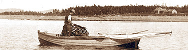 A man hauls a lobster trap into his boat by hand in 1894.