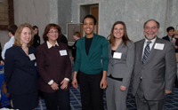 Patience Singleton, Counsel at US House Committee on Financial Services (center), chats with OCC staffers during the NCPW event on Capitol Hill.  
