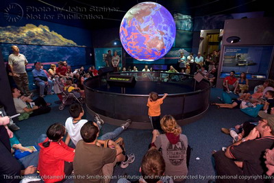 audience viewing Sumatra tsunami animation on NOAA's Sccience on a Sphere at the Smithsonian