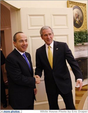 President George W. Bush greets Mexico's President Felipe Calderon for their meeting Tuesday, Jan. 13, 2009, in the Oval Office at the White House. White House photo by Eric Draper