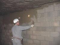 Miner finishing a stopping constructed from brick