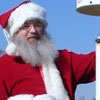 Santa posing with a GPS receiver