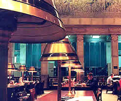 Photo:  readers using the tables in the main part of the Reading Room.