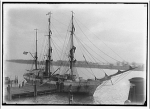 Two-masted ship at a dock