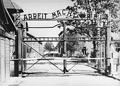 The entrance to the main camp at Auschwitz, bearing the motto “Arbeit Macht Frei.”