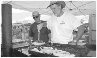 Image of volunteers cooking food items