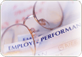 Image of Eye Glasses and a Performance Review Form